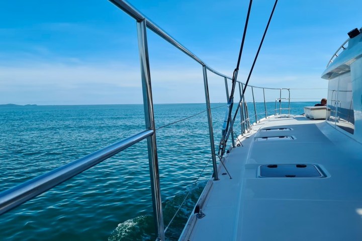 a boat is docked next to a body of water